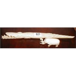 An ivory elephant together with a crocodil...