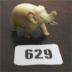 A miniature C19th Ivory elephant...