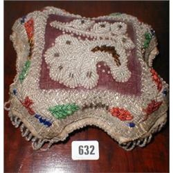 A Victorian pin cushion with hand stitched...