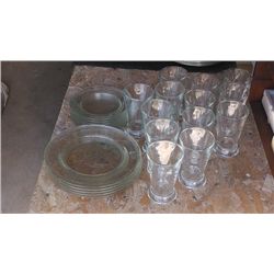 Set of plates and glasses .