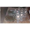 Image 1 : Set of plates and glasses .