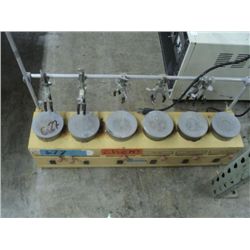 VILE HOLDER FOR OVEN HEATING UNIT