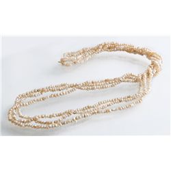 A Three Strand Natural Pearl Necklace
