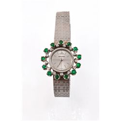 An 18 Karat Gold, Diamond and Emerald Lady's Wristwatch