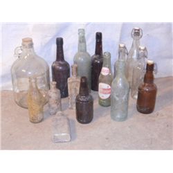 GREY CRATE FULL OF 15 VINTAGE GLASS BOTTLES