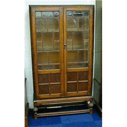 Oak china cabinet, fitted a pair of glazed do