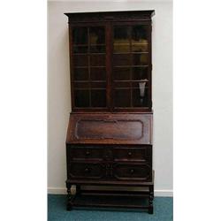 Oak bureau bookcase, the carved moulded corni