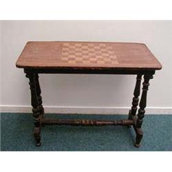 Victorian walnut games table on ebonised turn