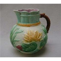 Majolica floral jug decorated in blues, yello