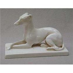 White glazed Minton pottery greyhound on a ba