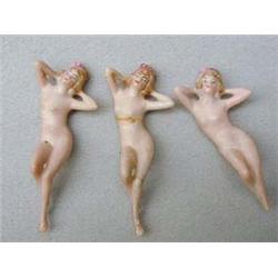Three nude pin cushion dolls