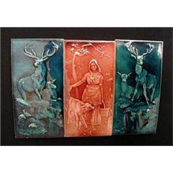 Two large blue glazed pottery tiles of deer f