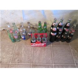 One Case Soda Bottles With Some Unopened Cola