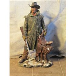 Cast Mountain Man With His Rifle Holding Saddle