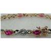 Image 2 : STERLING / GOLD RUBY BRACELET 4.77 CTW