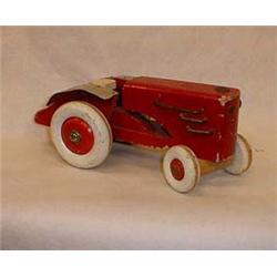 Tractor of wood with white wheels, swinging f