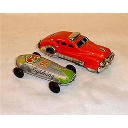 2 cars of tin: the red one is unmarked, c. 13