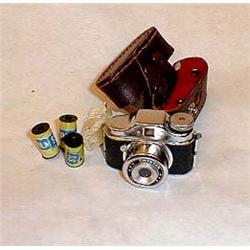 Tiny photo camera with film, marked Crystar m