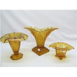 3 Amber glass vases.