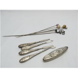 Selection of hat pins and manicure set.