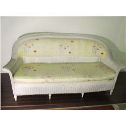 White wicker settee.