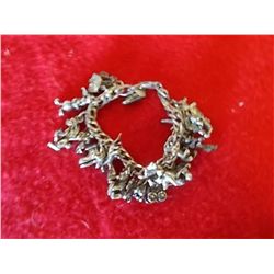 Disney Charm Bracelet  Marked .925 Silver several charms