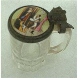 Glass stein with ceramic lid. Man taking off