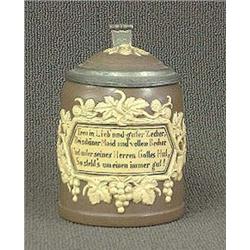 Mettlach stein. Dark brown with cameo decorat