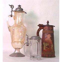 Three steins: carved wood, gold iridescent, a