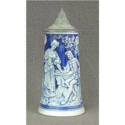 Blue salt glaze stein with pewter lid. Woman