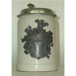 Stoneware stein with pewter lid and shield. N