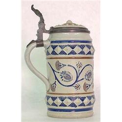 German stoneware stein. Design on face border