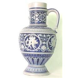 Blue salt glaze pitcher. Putti decoration. No