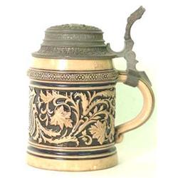 German stein with pewter lid. Shield and scro