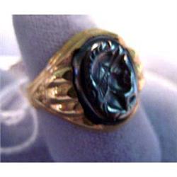 10k man's ring. Yellow gold with carved hematite stone. 5.9 grams $65-85