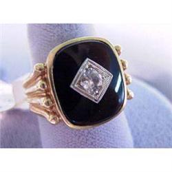 10k man's ring. Yellow gold with quartz stone set in black onyx.  7.5 grams $85-100