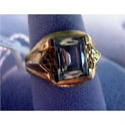 10k man's ring. Yellow gold with synthetic gemstone. 4.3 grams $65-85