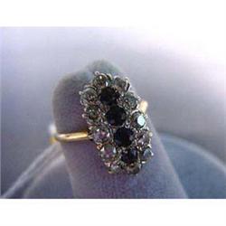 14k lady's antique ring. Diamond and sapphire ring has four blue  sapphires surrounded by twelve Eur