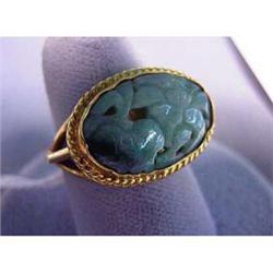 18k-22k lady's ring. Yellow gold with carved jade. 9.4 grams $175-200