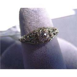 18k lady's antique ring. White gold with 3.5 mm European cut  diamond. Diamond estimated weight is .