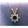 Image 1 : Lady's 14k  ruby and diamond pendant, with 8 full cut diamonds  surrounding 4mm round ruby. Estimate