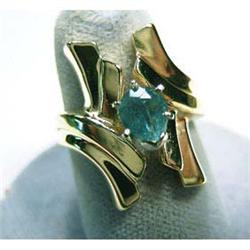 Lady's 14k ring with .75 carat natural emerald. Emerald is a dark  green color. Ring size 7 1/2. 8 g