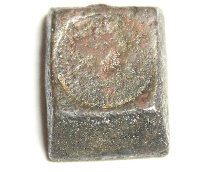 Rectangular brass coin weight, marked XXVII on back.