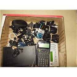 Box Misc. 2-Calculators-1-Enterwrite approx 14 Several Head Phones , 1- cassette  player