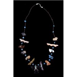 Single Strand Fetish NecklaceUnique arrow points attached to each animal,  large black Raven in cent