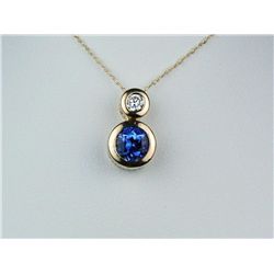 High Quality 14K YG Ladies Italian Design NecklaceBezel set  with a fine round Tanzanite  weighing a
