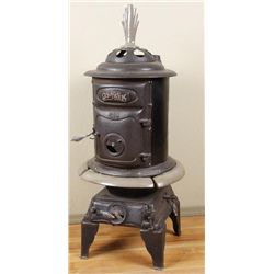 Osage Oak 1891 Pot Belly StoveBlack and gray polychrome finish, has had  restoration,  in good worki