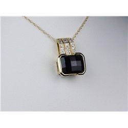 Splendid 14K Yellow Gold Ladies PendantFine set with a center checkerboard cut red  garnet weighing 