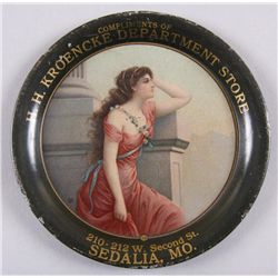 Original Tin Advertiser - H H Kroencke Dept Store"210-212 W Second St, Sedalia, MO.",  depicting a m