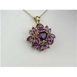 Exquisite 10K YG Flower Design NecklaceSet with nice purple garnets weighing approx  3.00 carats. Re